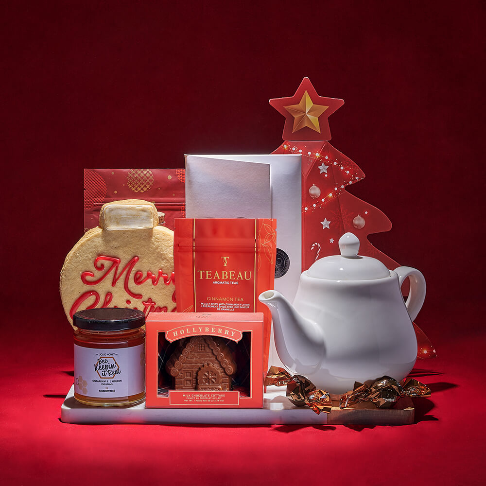 Festive Christmas Tree Gift Box Featuring Tea Pot and Chocolate Treats – how the gift is presented